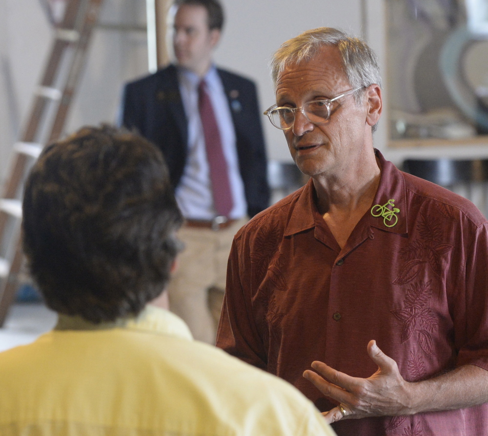 U.S. Rep. Earl Blumenauer, D-Oregon, meets with individuals after speaking about marijuana at the Urban Farm Fermentory in Portland on Thursday.