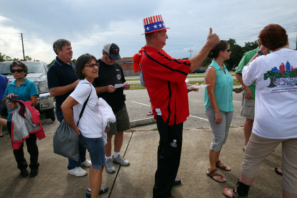 Billy Rand of Fairview, Alabama, and thousands of other Donald Trump supporters wait in line outside Ladd-Peebles Stadium hours before the start of a rally in Mobile, Alabama, on Friday.