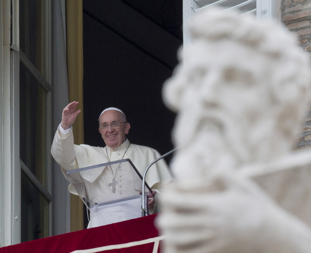 Pope Francis delivers his blessing from his studio overlooking St. Peter’s Square in Vatican City this week. The pontiff will attend the World Meeting of Families in Philadelphia on Sept. 26 and 27 – a meeting that occurs as divides deepen in the church over LGBT issues and concerns.