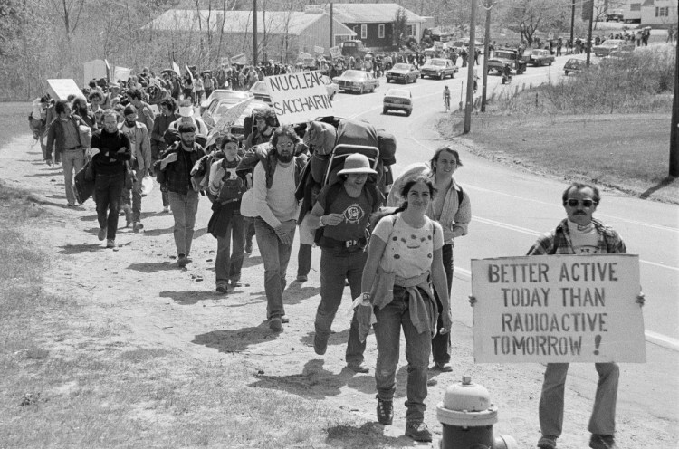 Anti-nuclear power demonstrators march toward the front gate of the nuclear power station construction site in 1977 in Seabrook, N.H. AP file photo