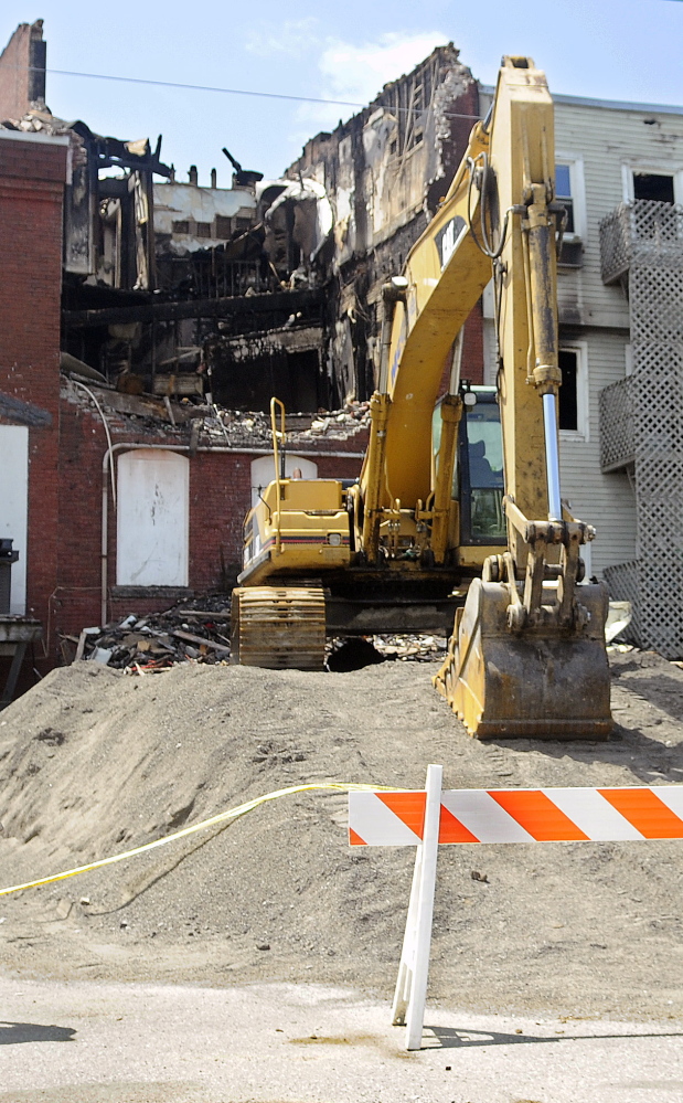 Four days after the July 16 fire, damage is evident on the back side of Water Street buildings in Gardiner.