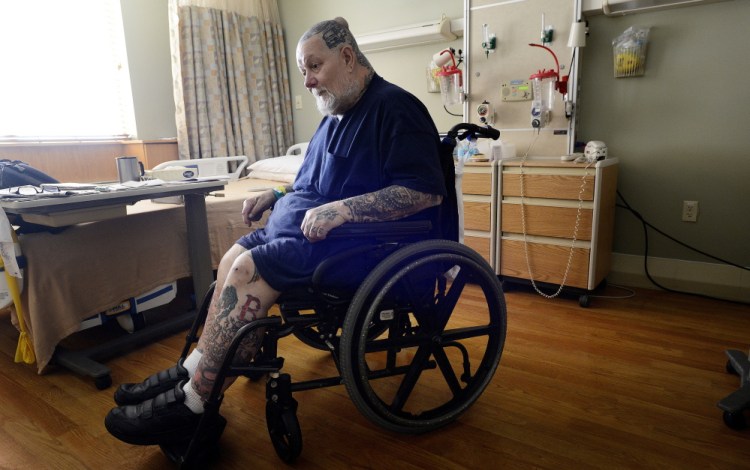 Eric Chipman, seen in a wheelchair in a hospital room at Southern Maine Health Care in Sanford on Wednesday, suffered a number of debilitating injuries as the result of a motorcycle accident in 1976. 
Shawn Patrick Ouellette/Staff Photographer