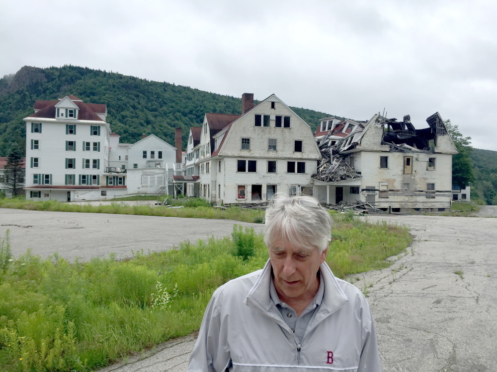Dixville Notch, New Hampshire, has gotten attention from the media and politicians since it began midnight voting in 1960. Developer Les Otten bought the Balsams Resort, shown in ruins in 2015, and has plans to turn it into a ski destination.