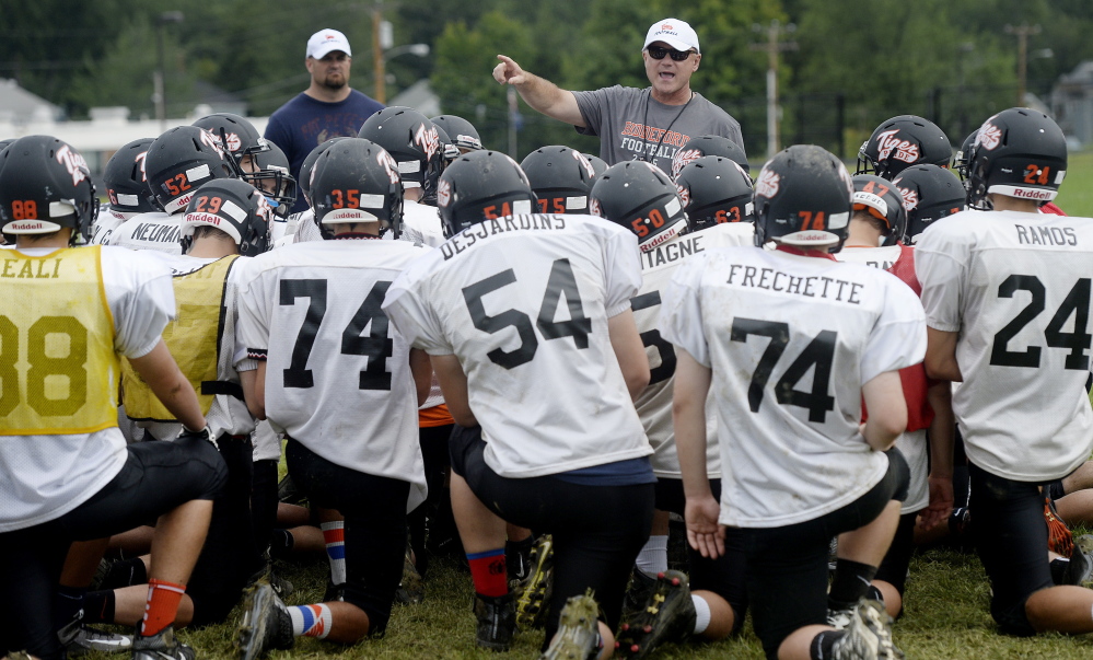 Brian Curit, center, is in his second stint as the Tigers’ head coach and led Biddeford to its last state title in 1994.