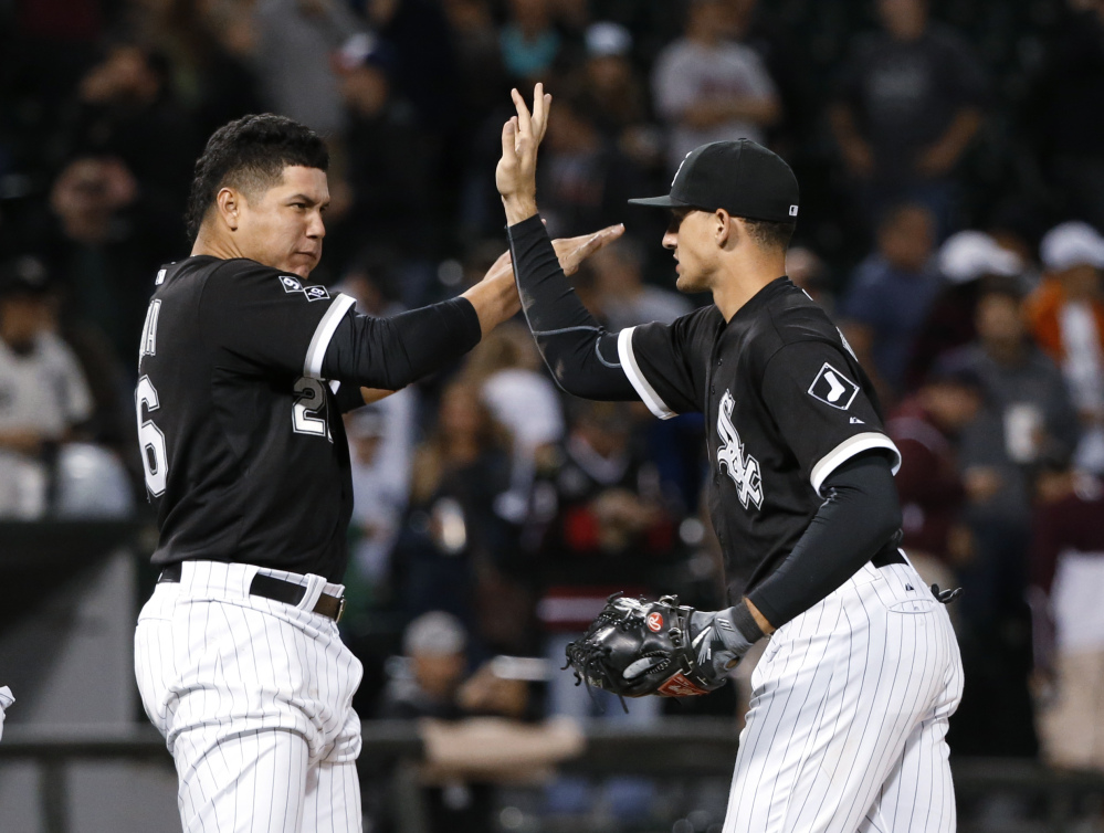 White Sox designated hitter Avisail Garcia, left, celebrates with right fielder Trayce Thompson as Chicago takes a 5-4 win over the Red Sox on Tuesday night. Thompson finished 3 for 4 and was a home run shy of hitting for the cycle.