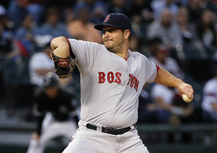 Red Sox starter Wade Miley pitches in the first inning Tuesday night in Chicago. Miley took the loss, giving up five runs on 13 hits.