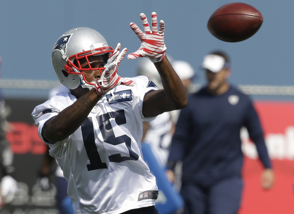 New England Patriots wide receiver Reggie Wayne makes a catch during practice in Foxborough, Mass., on Wednesday, Aug. 26, 2015.