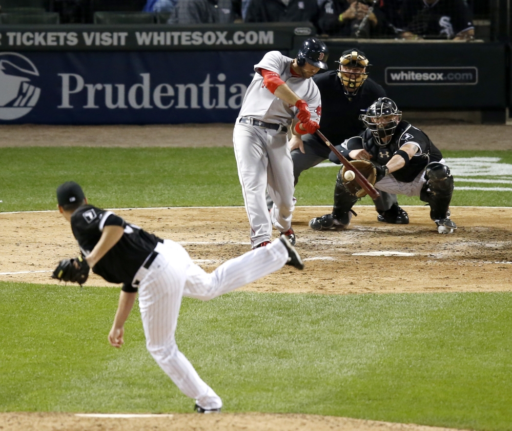 Boston’s Travis Shaw hits a two-run home run off White Sox relief pitcher Nate Jones in the eighth inning of Wednesday night’s 3-0 win in Chicago.