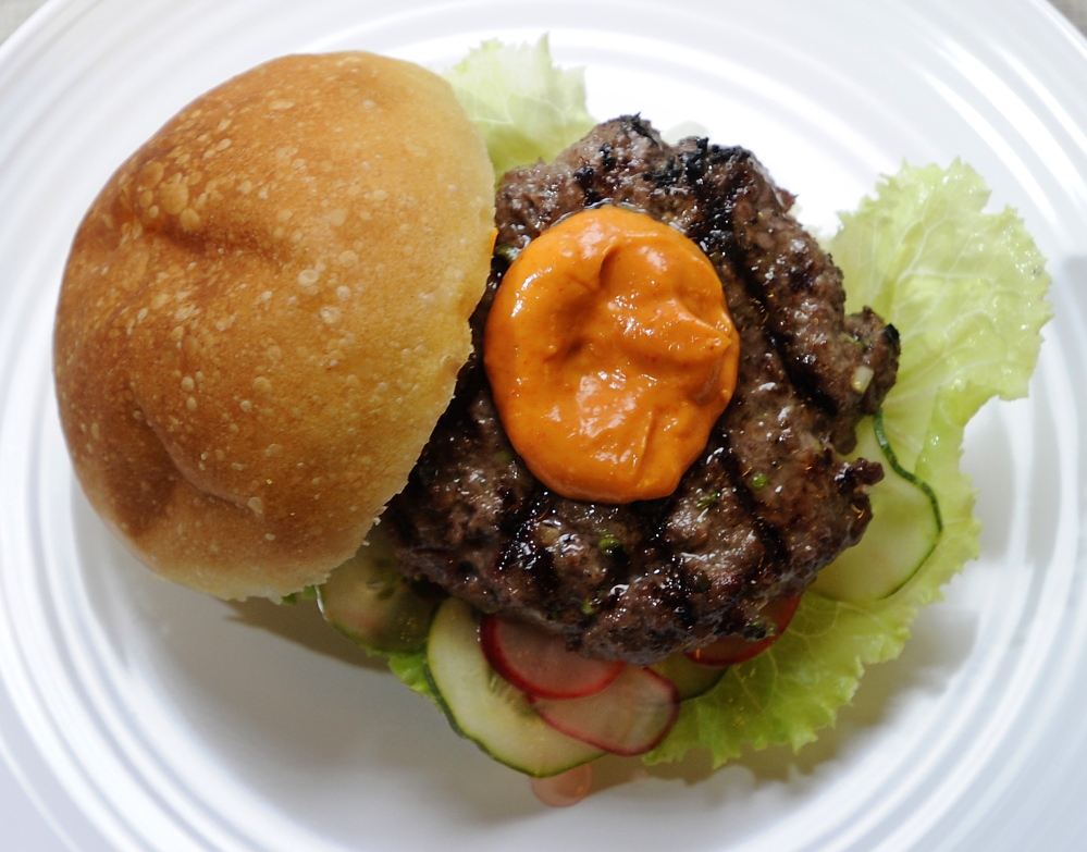 A Korean barbecue burger, made with local grass-fed beef, with homemade quick pickles and spicy mayonnaise.