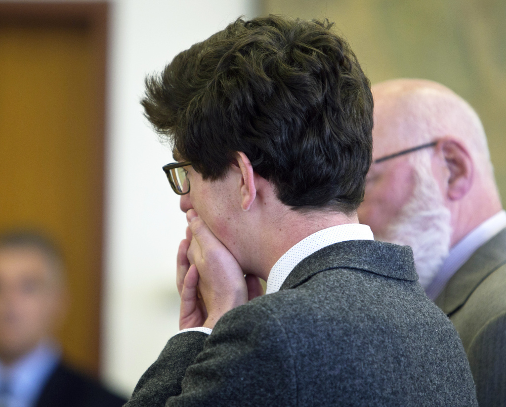 Former St. Paul’s School student Owen Labrie puts his hands to his face as his verdict is read in Merrimack County Superior Court in Concord, N.H., on Friday  Labrie was cleared of felony rape but convicted of misdemeanor sex offenses against a 15-year-old girl.