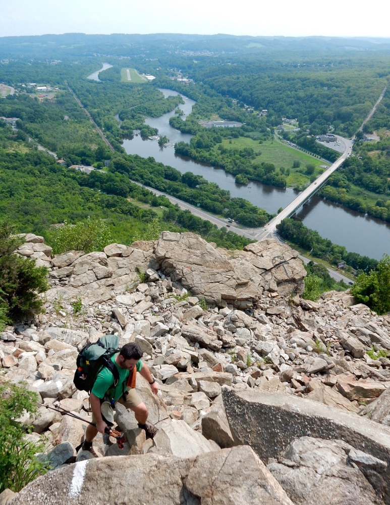 Bryan “Walking Home” Loisel of Gray scrambles up the rocks on Blue Mountain from the Lehigh River Valley in Pennsylvania.