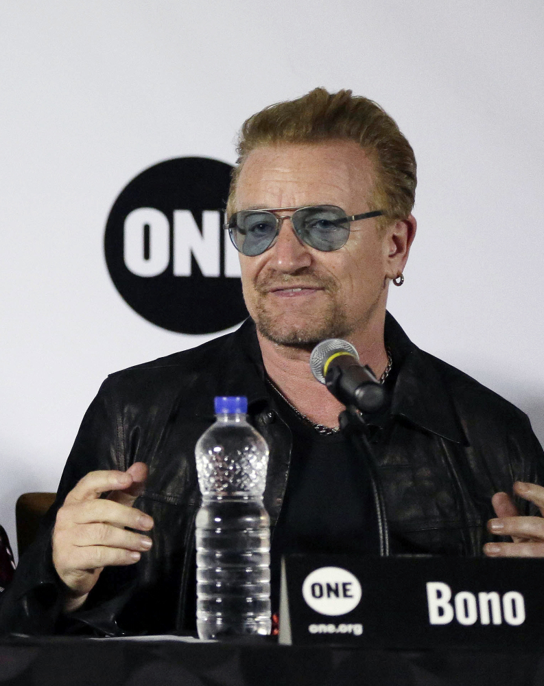 Irish rock star Bono discusses his empowerment plan at a news conference  in Lagos, Nigeria, on Friday.