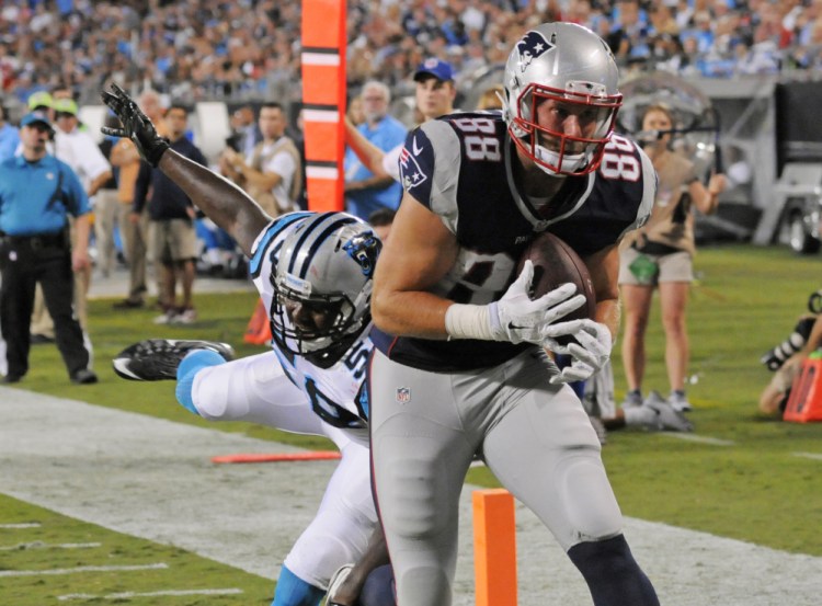 The Patriots’ new tight end Scott Chandler catches a touchdown pass from Tom Brady to cap an 80-yard scoring drive.
