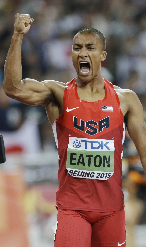 Ashton Eaton has reason to celebrate after running the 400 meters in 45 seconds to set a world-record time for the decathlon event Friday in Beijing.