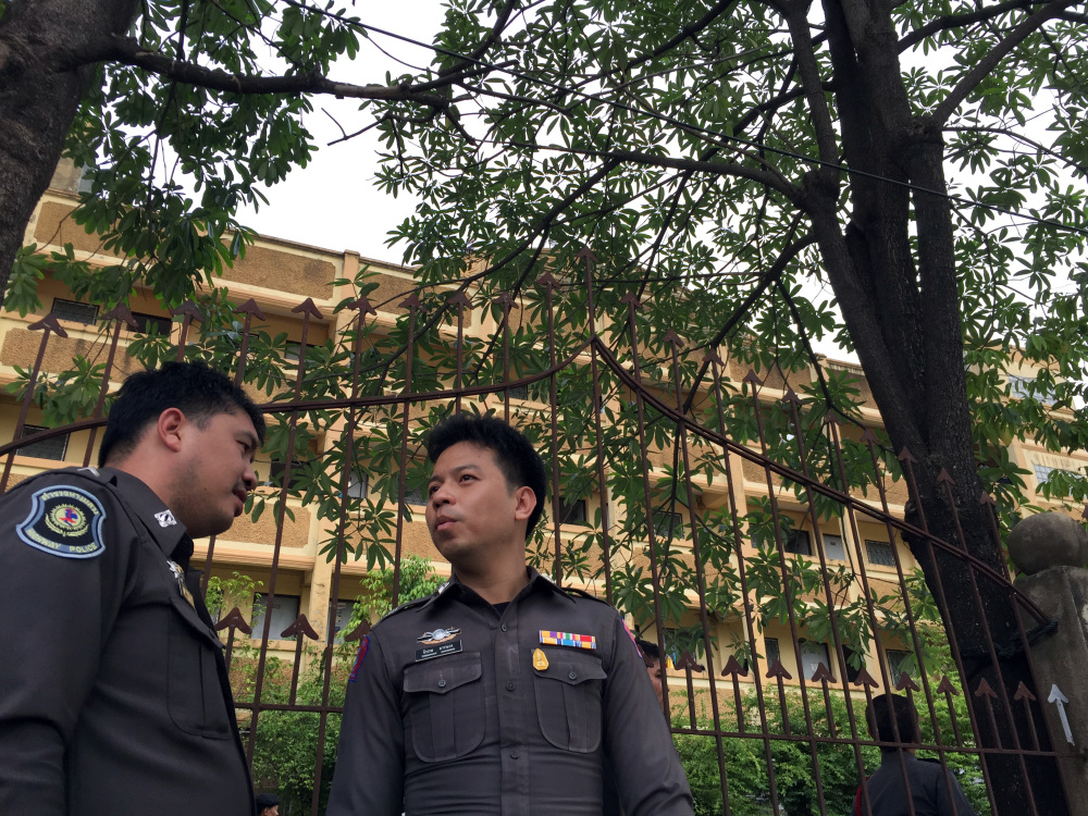 Thai police stand outside an apartment building in Nong Jok on the outskirts of Bangkok on Saturday. Thai police say they arrested a suspect in the blast at the Erawan Shrine on Aug. 17 in this apartment building Saturday. The Associated Press 