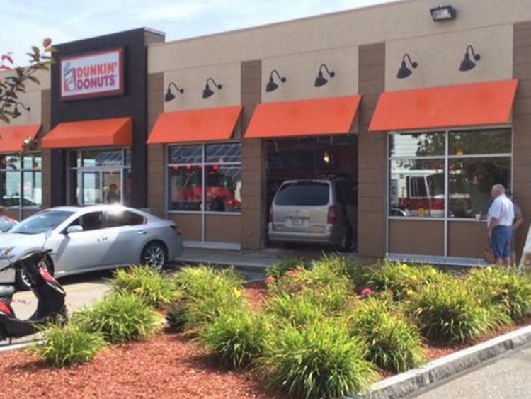 A minivan plowed through a window and into the dining area of the Dunkin’ Donuts on Spruce Street Saturday morning, injuring several customers.