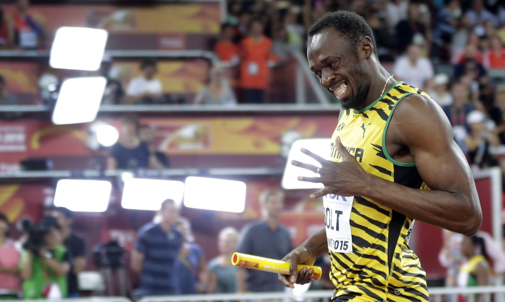 Jamaica’s Usain Bolt celebrates after anchoring the team to the gold medal in the men’s 4x100m relay at the world championships in Beijing on Saturday.