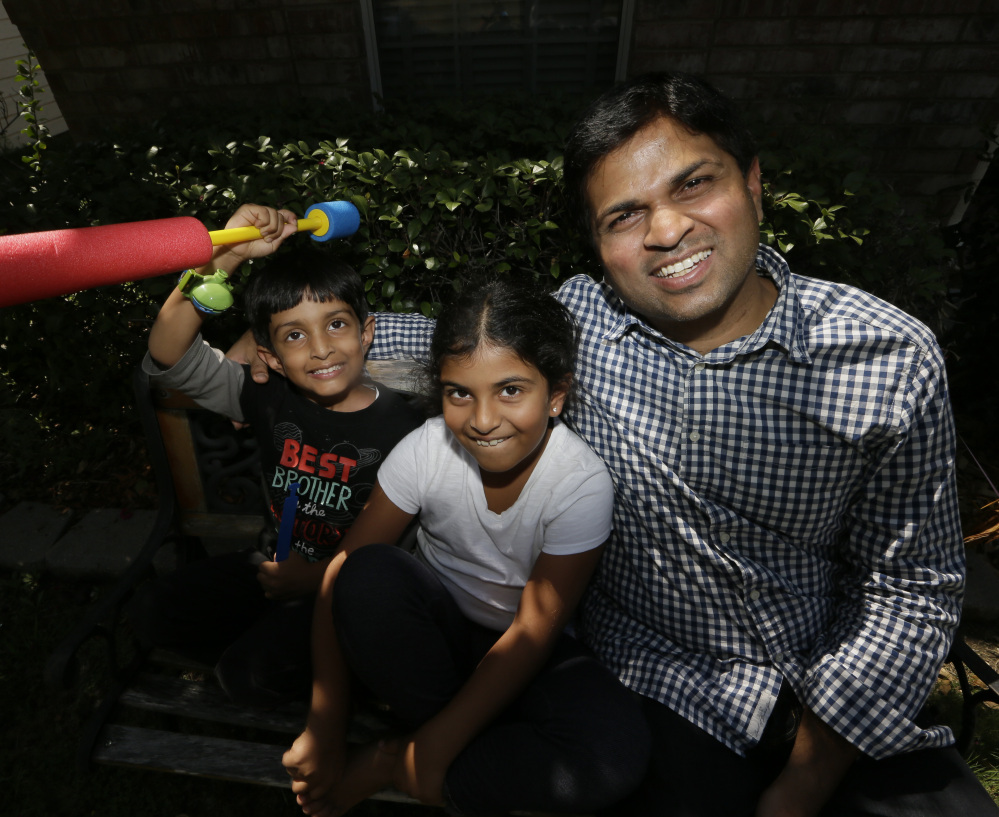Siddharth Jaganath, right, is among the growing numbers of east Indians who migrate to the U.S. He and his children, Sita, 7, center, and Neel, 4, live in Plano, Texas.