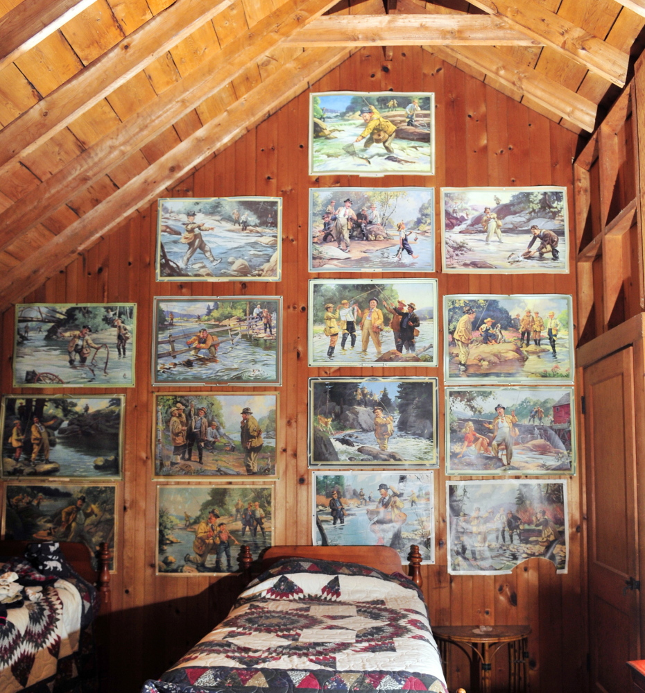 A collection of vintage fishing posters hangs in an upstairs bedroom of the Harwood Camp, one of 11 stops on the Homes of Wayne Tour on Sept. 12.