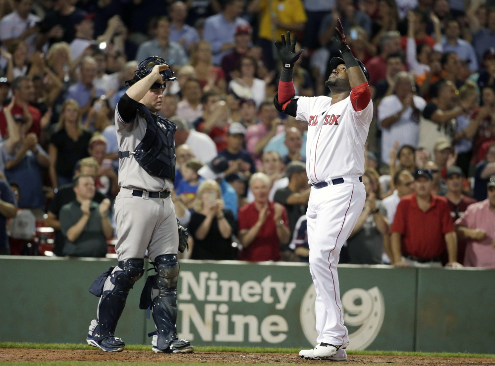 Red Sox designated hitter David Ortiz crosses the plate after hitting his 495th career home run in Boston’s 4-3 win over the New York Yankees on Monday in Boston.
The Associated Press