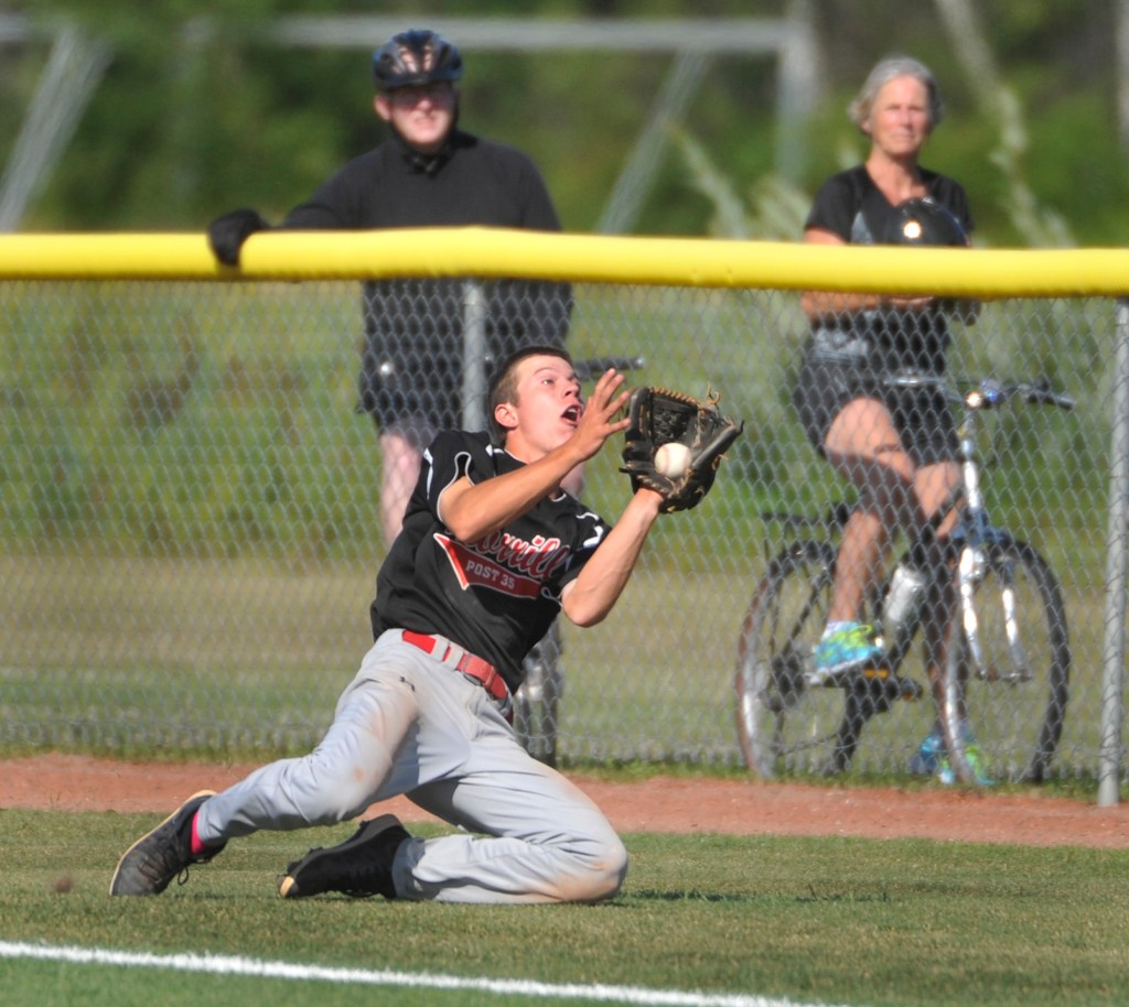 Morrill Post right fielder Jacob Brown makes a sliding catch of a foul ball in the fifth inning against Coffee News. Morrill won three straight elimination games to reach the final but couldn’t dethrone the defending champions. John Ewing/Staff Photographer