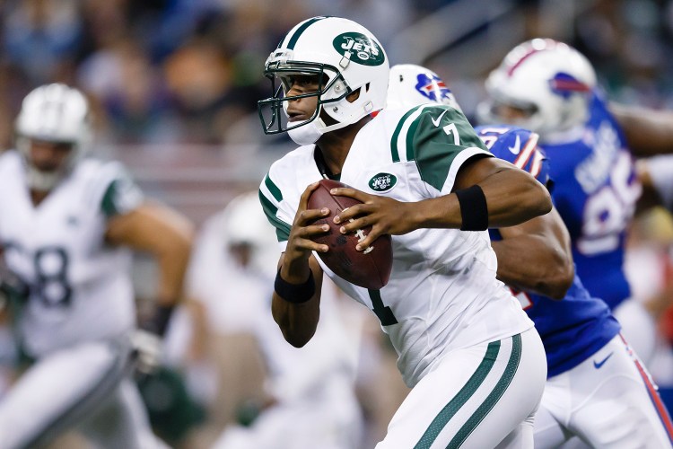 New York Jets quarterback Geno Smith runs the ball against the Buffalo Bills during a game last year. He has been sidelined with a jaw injury after being punched by a teammate.