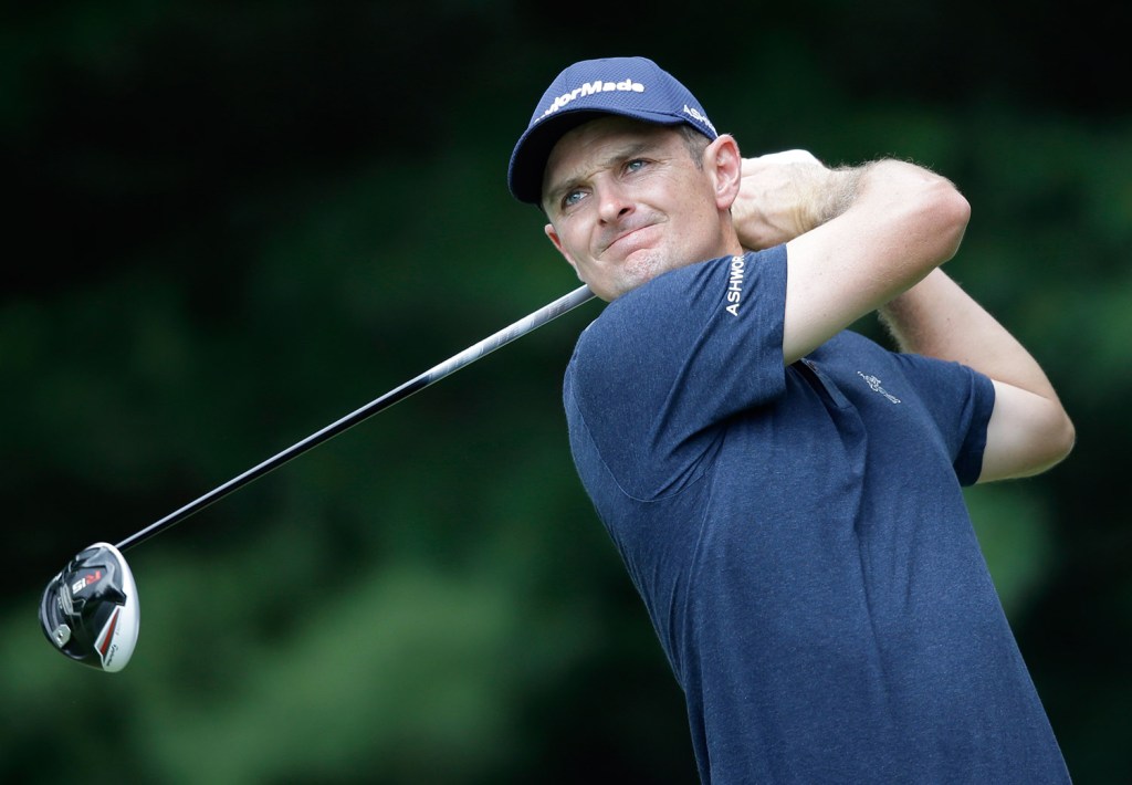 Justin Rose, from England, tees off on the second hole during the final round of the Bridgestone Invitational golf tournament. The Associated Press