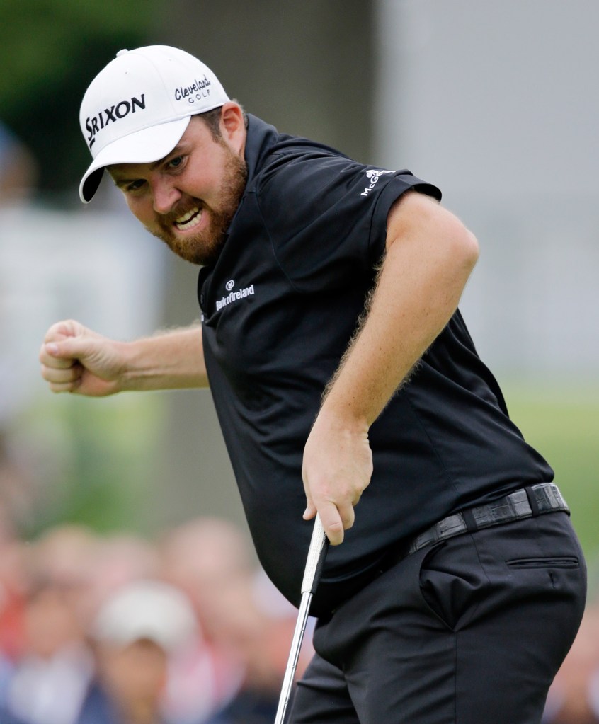 Shane Lowry, from Ireland, pumps his fist as he watches his birdie putt on the 18th hole to win the Bridgestone Invitational golf tournament at Firestone Country Club, Sunday in Akron, Ohio. The Associated Press