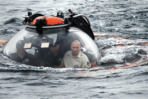 Russian President Vladimir Putin sits on board a bathyscaphe as it plunges into the Black Sea along the coast of Sevastopol, Crimea, Tuesday. Kremlin photo via AP