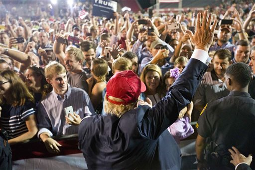 Republican presidential candidate Donald Trump waves to the crowd during a campaign pep rally in Mobile, Ala., on Friday. The Associated Press