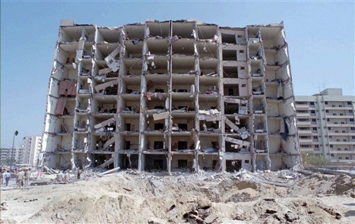 A 1996 photo of the destroyed Khobar Towers and crater where a truck bomb exploded, killing 19 Americans and injuring hundreds in Dhahran, Saudi Arabia. The Associated Press