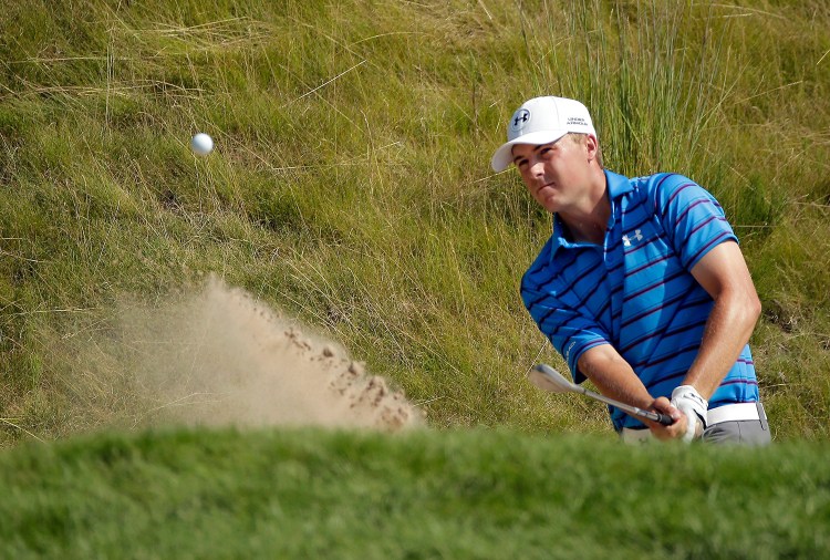 Jordan Spieth hits from a bunker on the 18th hole during the second round of the PGA Championship golf tournament Friday at Whistling Straits in Haven, Wis. Spieth made the shot for a birdie. 