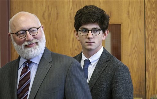 Looking in the direction of the victim's family, former St. Paul's School student Owen Labrie, right, enters the courtroom with his defense attorney J.W. Carney for closing remarks in Labrie's rape trial at Merrimack Superior Court Thursday in Concord, N.H. The Associated Press