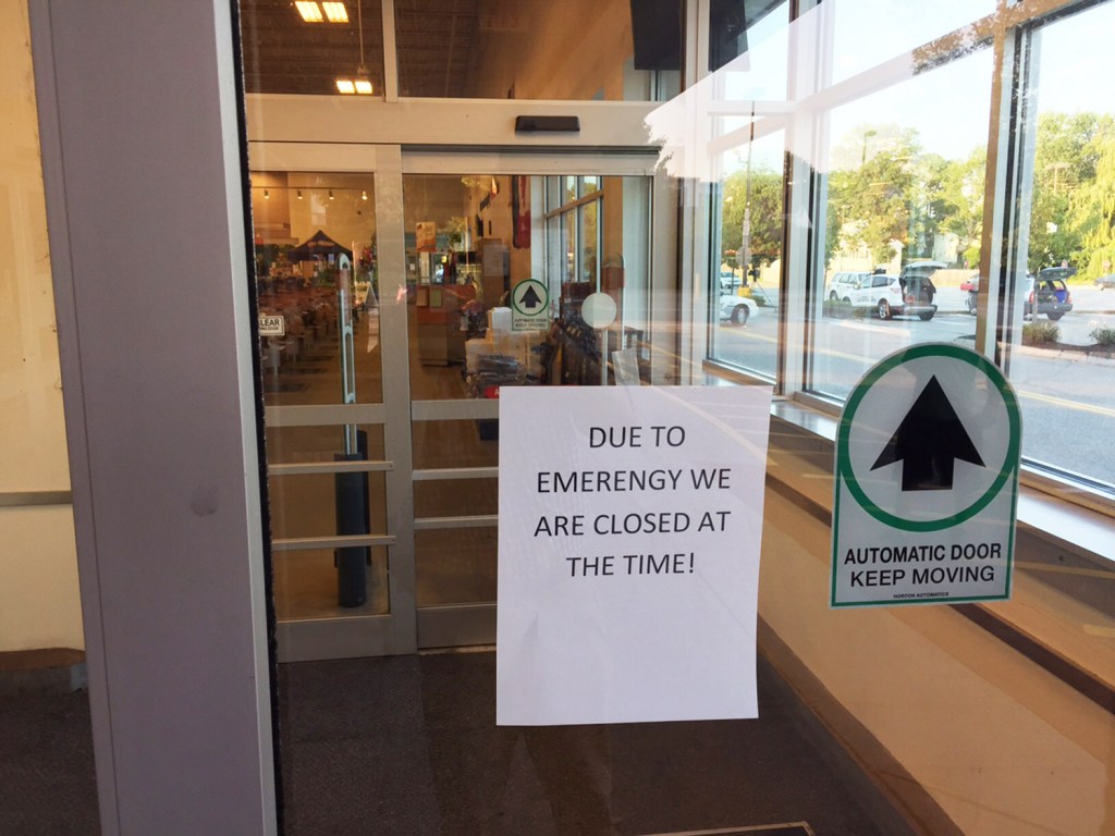 A sign announces that a Shaw's supermarket in Saco is closed to customers after a woman was stabbed to death there Wednesday.