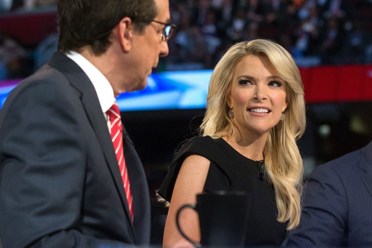Fox News moderator Megyn Kelly, right, listens as Chris Wallace, begins introductions during the first Republican presidential debate at the Quicken Loans Arena, in Cleveland. Angry over what he considered unfair treatment at the debate, Republican presidential candidate Donald Trump told CNN on Friday night that Kelly had "blood coming out of her eyes, blood coming out of her wherever." The Associated Press
