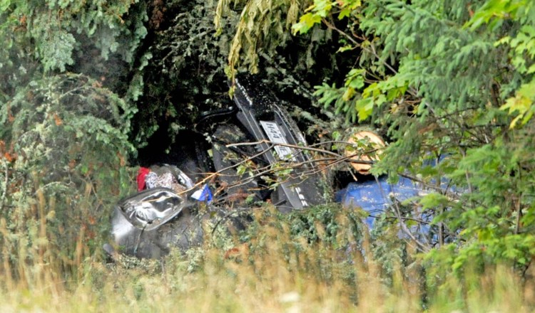 A car driven by a Quebec couple crashed on U.S. Route 201 in West Forks Plantation, likely on July 28, but was hidden from view when a tree fell on it, police say. 