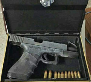 New York City police photo of loaded Glock found in hollowed-out King James Bible.