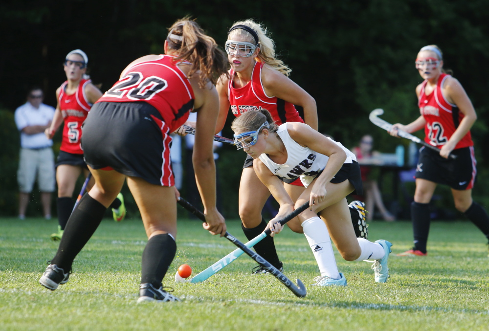 SOUTH BERWICK, ME - SEPTEMBER 2: Marshwood #2 Leah Glidden drives between Scarborough defenders in the first half at Marshwood field hockey. (Photo by Jill Brady/Staff Photographer)