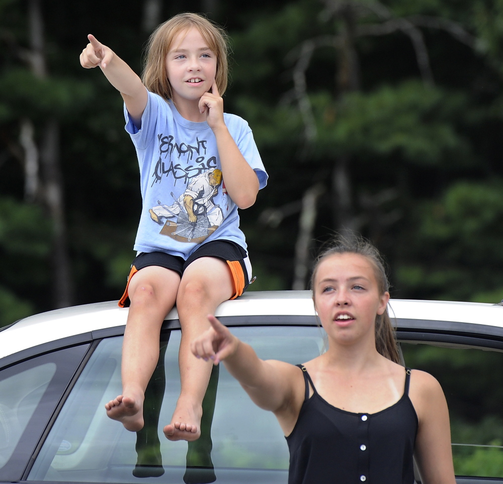 Abbey Steinhagen, 10, and her sister Nicole Steinhagen, 19, from South Portland, point out the planes flying over Fat Boy Drive In in Brunswick.
Gordon Chibroski/Staff Photographer