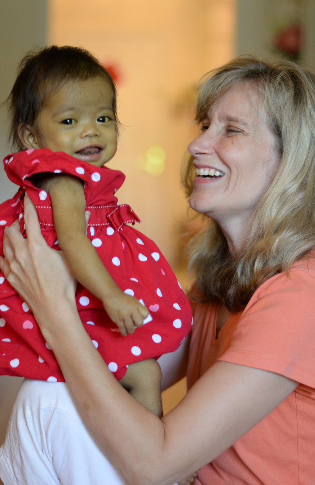 Cindy Morrison, a single mother, holds Hope, her fifth adopted daughter from China, who is getting care at Boston Children’s Hospital and Andover Pediatrics.