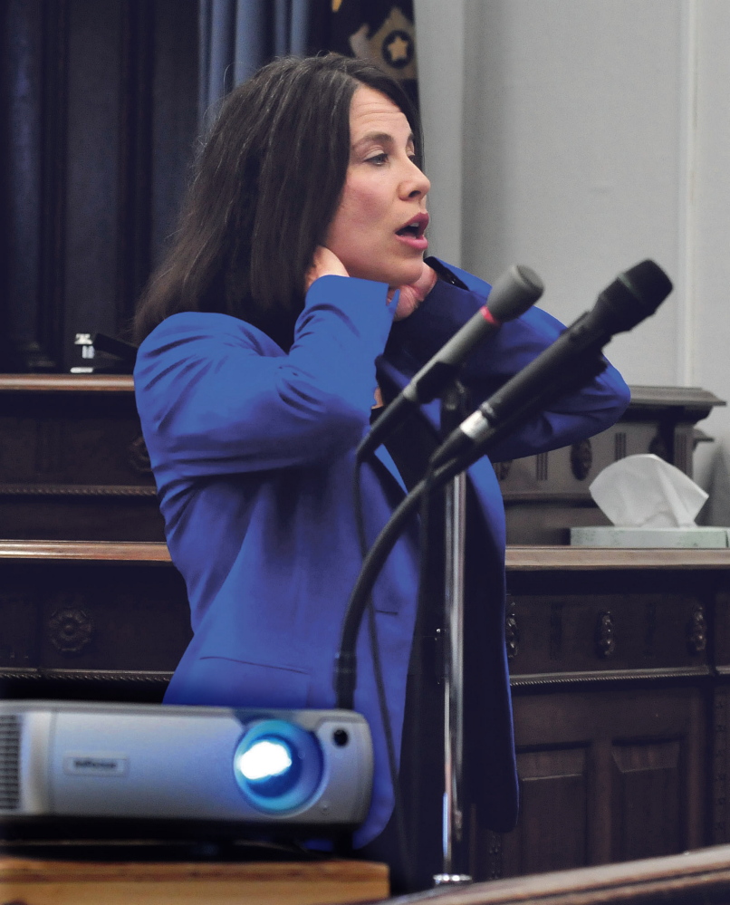District Attorney Maeghan Maloney illustrates being strangled during closing arguments to the jury Friday in the domestic violence case against Andrew Maderios in Somerset County Superior Court in Skowhegan.