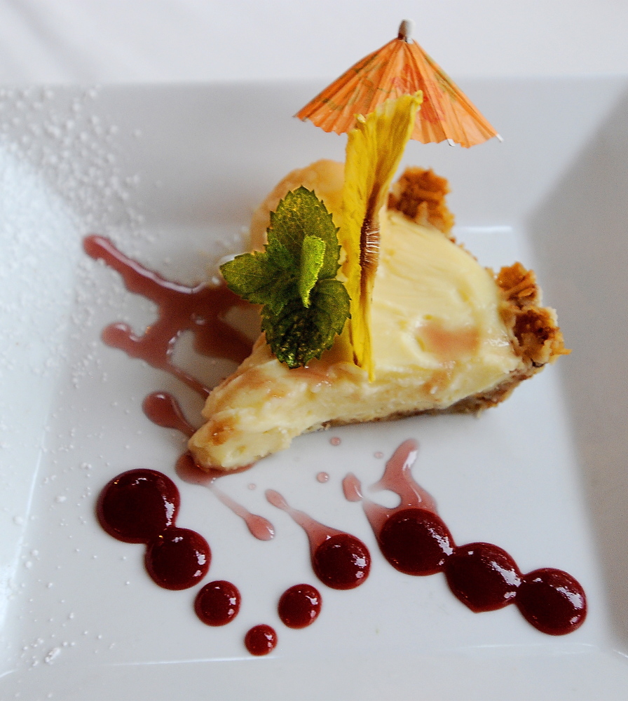 Mai Tai Pie features a coconut custard filling in a crust of crushed macaroons and a cherry-and-brandy syrup.