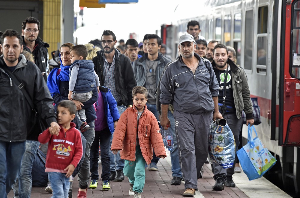 Refugees from Syria arrive at the train station  in Dortmund, Germany, on Sept. 6. The Maine Council of Churches and other religious groups are condemning calls to halt the resettlement of refugees in the U.S. in response to last week's attacks in Paris.