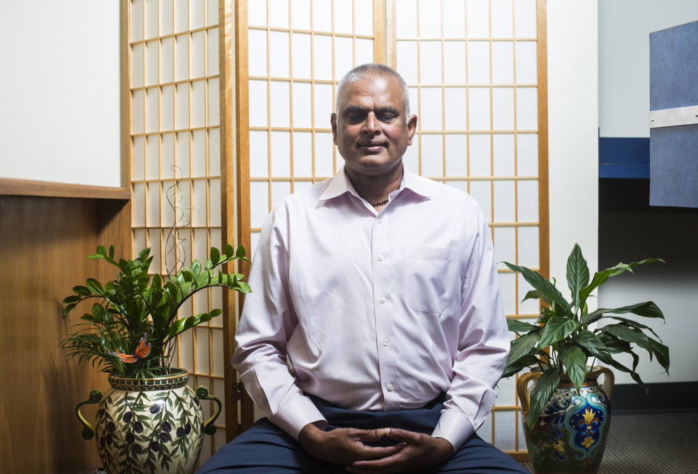 Ashok Nalamalapu of the South Portland IT company iCST says meditating makes meetings “go smoother.”