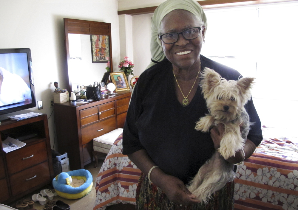 Bonnie Jean Cook lives with her therapy dog, a Yorkshire terrier named Bella. The Associated Press