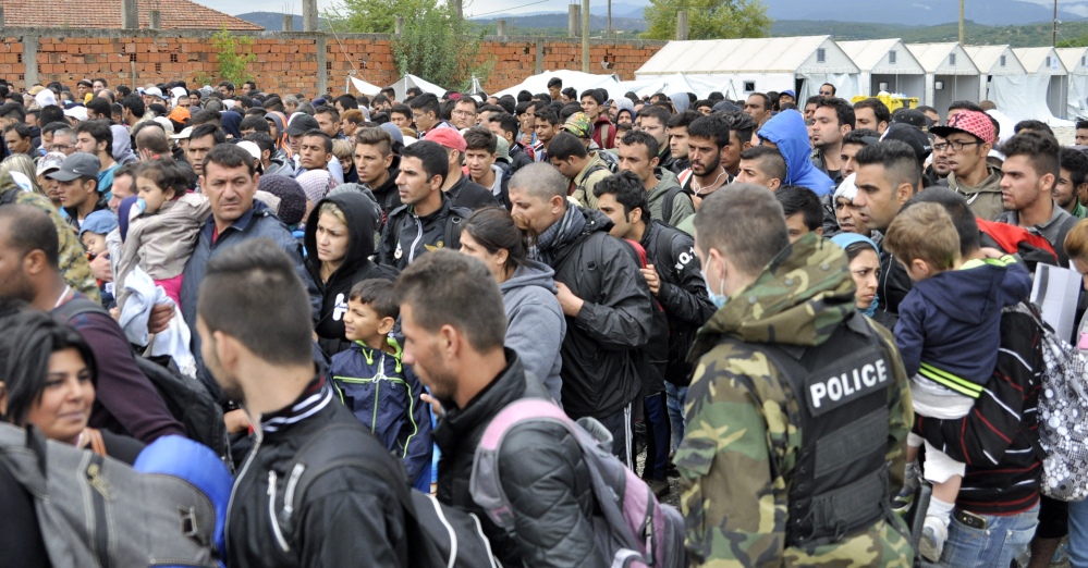 People prepare to leave a refugee camp in the southern Macedonian town of Gevgelija on Tuesday.