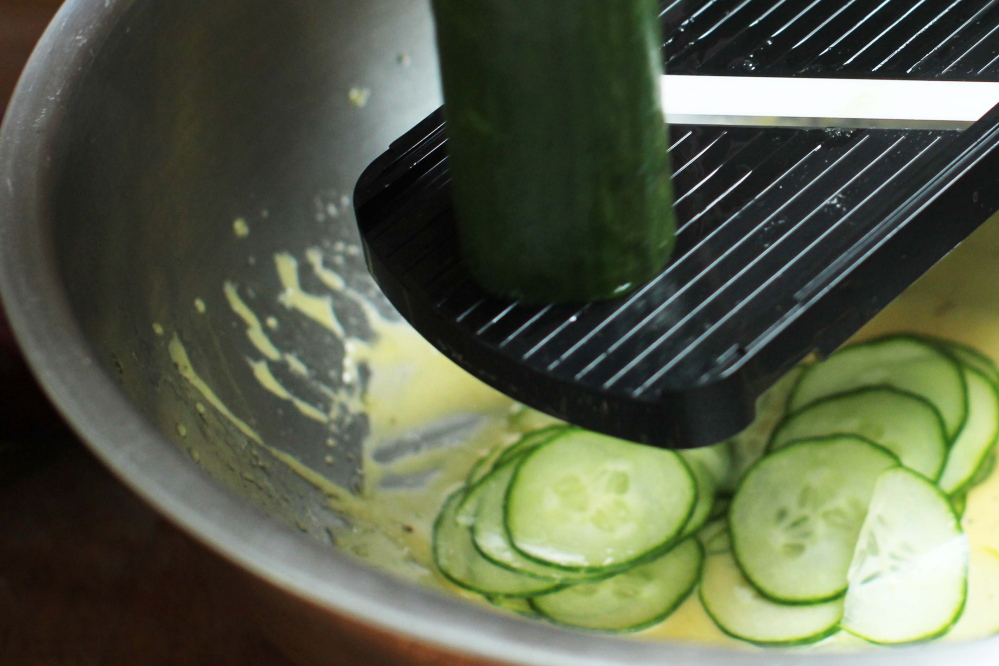 A mandoline makes short work of an English cucumber. Bell pepper and onion follow. 