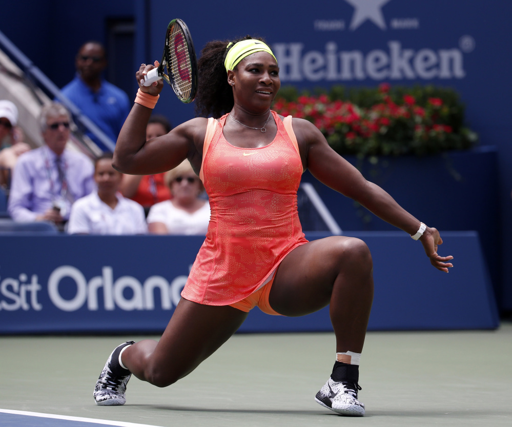Serena Williams reacts after a shot to Roberta Vinci, of Italy, during a semifinal match at the U.S. Open tennis tournament, Friday, Sept. 11, 2015, in New York. (AP Photo/Julio Cortez)