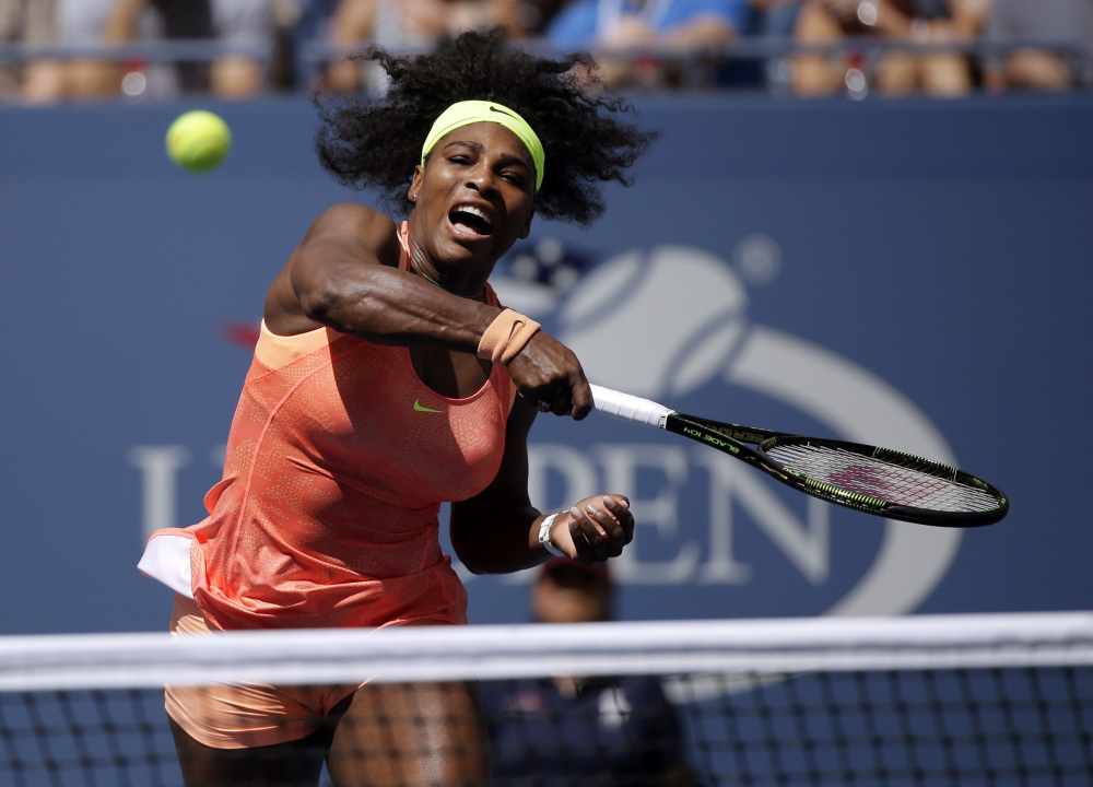 Serena Williams returns a shot to Roberta Vinci, of Italy, during a semifinal match at the U.S. Open tennis tournament, Friday, Sept. 11, 2015, in New York. (AP Photo/Bill Kostroun)