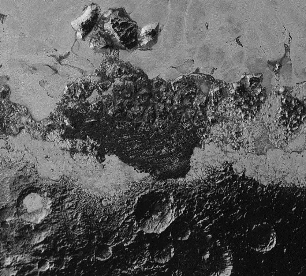 This July 14 photo provided by NASA shows a 220-mile-wide view of Pluto taken from the New Horizons spacecraft. The new close-up images of Pluto reveal an even more diverse landscape than scientists imagined before New Horizons swept past Pluto in July.